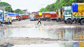 A potholed road at Transport Nagar in Jammu.