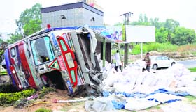 A speeding truck overturns at Panama Chowk in Jammu on Sunday night. The driver and cleaner had a narrow escape.