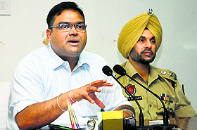 Bathinda DC Basant Garg and SSP Gurpreet Singh Bhullar interact with mediapersons on Monday.