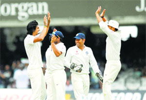 Ishant Sharma (left) celebrates the wicket of Joe Root on Day 5 of the second Test at Lords in London on Monday