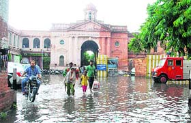 Rain water clogging the road ahead of the MC office, where a water treatment plant has been installed in Amritsar.