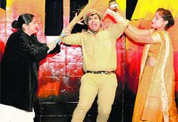 Artistes enact a scene from a play, "Chukayenge Nahi", at the Punjab Kala Bhawan, Sector 16, in Chandigarh on Tuesday. Tribune photo: Vicky Gharu
