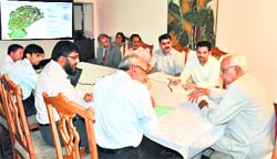 Governor NN Vohra with officials of the Central University of Kashmir during a meeting in Srinagar on Tuesday. A Tribune photograph