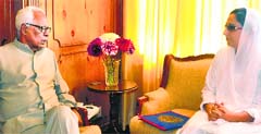 Governor NN Vohra with Darakhshan Andrabi, president, Socialistic Democratic Party, at Raj Bhawan in Srinagar on Tuesday. A Tribune photograph