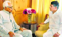 Governor NN Vohra with state Chief Information Commissioner GR Sufi at Raj Bhawan in Srinagar on Tuesday. A Tribune photograph