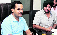 Deputy Commissioner KK Yadav and NRI Sabha president Jasvir Singh Gill address media persons in Jalandhar on Tuesday