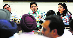 Deputy Commissioner Rajat Aggarwal interacts with officials of various departments in Ludhiana on Tuesday. 