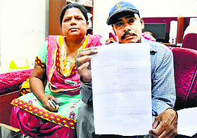 Charan Singh, who is employed with the Animal Husbandry Department, shows the letter approving an advance from his general provident fund in Ludhiana.
