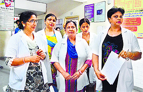 Staff nurses of the Civil Hospital show a copy of the memorandum submitted to the SMO, Ludhiana.