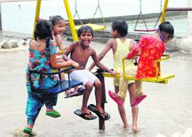 Freedom at last: Women inmates children enjoy the rain inside the Central Jail premises in Amritsar on Wednesday