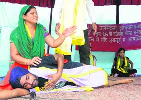 Theatre artistes stage a play during the de-addiction awareness campaign by the BSF