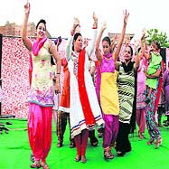 Women enjoy dance during the Teej festival organised at Pratap Nagar in Bathinda on Wednesday.