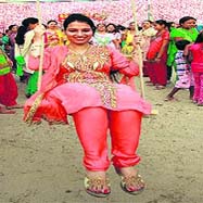 A girl enjoys swing during a Teej festival at Pratap Nagar in Bathinda on Wednesday