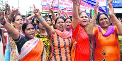 Members of the Anti-Corruption and Crime Control Cell protest in Dehradun on Wednesday. A Tribune photograph
