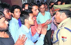 Students protest at DBS College in Dehradun on Wednesday. A Tribune photograph