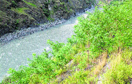 A muck-dumping site of Chamera-III on the bank of the Ravi on the Chamba-Bharmour highway
