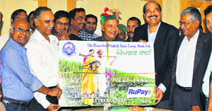 Chief Minister Virbhadra Singh launches the RuPay KCC Debit Card of HP Co-operative Bank in Shimla on Wednesday