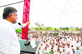 Former Congress MLA Kulbir Beniwal addresses a meeting at Adampur in the district on Tuesday