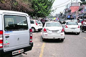 Haphazardly parked vehicles at Gole Market in Jammu.