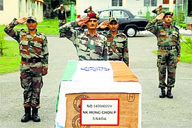 Army men pay tribute to the slain Naik Mongchon P during the wreath-laying ceremony in Akhnoor.