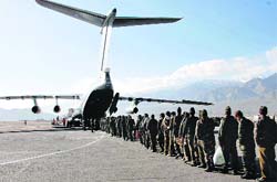 Troops line up to board an IAF IL-76 at Leh airfield. a file photo