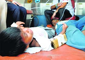 Children of Parkash Nagar in Ludhiana, who are suffering from diarrhoea, being taken to a hospital on Wednesday