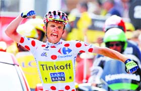 Rafal Majka of Poland reacts as he crosses the finish line to win the 124.5km 17th stage on Wednesday