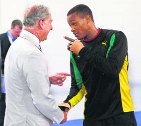 When Clarkes met Clarke: Britain's Prince Charles exchanging pleasantries with the Jamaican boxer, Cheavon Clarke, during a visit to boxing arena on Tuesday