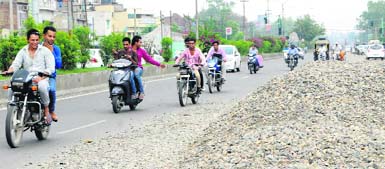 Commuters pass through a road near the GT Road in Amritsar. 