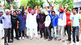 Members of the Contract PRTC Workers Union (Azad) raise slogans outside the GMs office in Bathinda on Thursday.