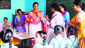 Chairperson of the Red Cross Hospital Welfare Branch, Bathinda, Venus Garg, interacts with students of Mahant Gurbanta Dass School for Deaf and Dumb in Bathinda on Thursday.