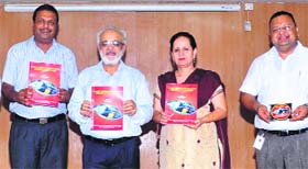 Chairman of the Baba Farid Group of Institutions, Gurmeet Singh Dhaliwal, releases a book on management in Bathinda on Thursday.