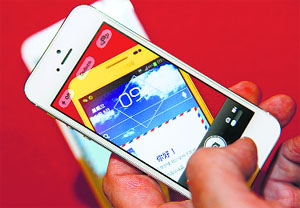 In this file photo, a man uses an iPhone 5 to take a picture of a Samsung Galaxy Note smartphone in Beijing. China, the worlds biggest mobile market, has registered a sale of over 200 million smartphones in the first half of 2014, an increase of over 20% compared to the same period in 2013.