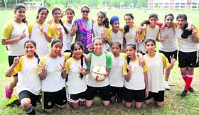 Girls football team of Saupins School, Sector 32, in a jubilant mood after winning the inter-school football tournament on Thursday.
