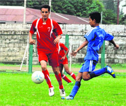 Players vie for the ball in a match in the Nemidas Memorial District Football League at Pavilion Ground in Dehradun on Thursday