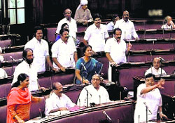 AIADMK and DMK members argue in the Rajya Sabha in New Delhi on Thursday