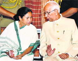 West Bengal Governor Kesari Nath Tripathi with Chief Minister Mamata Banerjee during his oath-taking ceremony at Raj Bhawan in Kolkata on Thursday