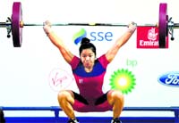 Chanu Saikhom completes a lift during the 48-kg womens weightlifting event. PTI 