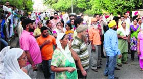 Family members of Varinder Singh stage a protest outside Sultanwind police station in Amritsar on Friday.