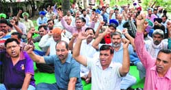 Members of the UT Powermen Union stage a protest outside the office of the Electricity Department at Sector 19 in Chandigarh on Friday. Tribune photo: Manoj Mahajan