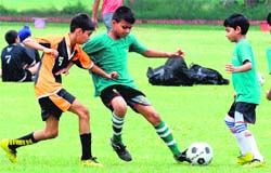 Players in action during a football match at Sector 26 in Chandigarh on Friday. Tribune Photo: S Chandan