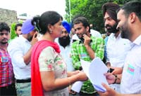 NSUI representatives hand over a memorandum to an official outside the Vice-Chancellors office at Panjab University on Friday. Tribune Photo: Manoj Mahajan