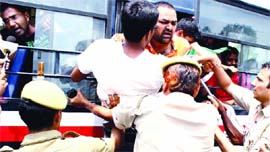 Civil Services aspirants being detained by the police at Vijay Chowk in New Delhi on Friday.