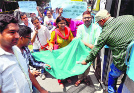 Angry polytechnic teachers beg in Dehradun on Friday. 