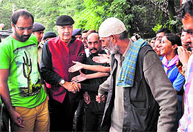 Fans try to shake hands with Bollywood actor Prem Chopra in Shimla on Friday. 