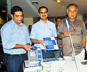 Cabinet minister GS Bali (extreme right), along with Rohan, the developer of smart cane devices, during a press conference at Kangra on Friday.