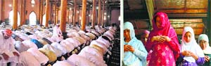Muslim men and a woman offer prayers to observe Jummat-ul-Vida inside a mosque in Srinagar on Friday. Tribune Photo: Yawar Kabli and AFP