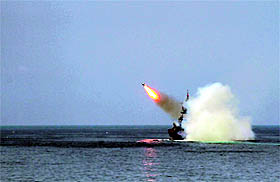 A Russian warship fires during a naval parade rehearsal in the Crimean port of Sevastopol on Friday. Russia will mark Navy Day on July 27.