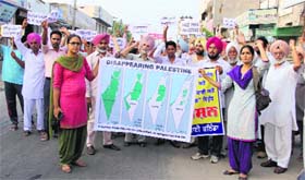 Shelling in Gaza, protest in city: Members of the Bathinda unit of Lok Morcha Punjab protest against the Isreali attack on Gaza on Saturday