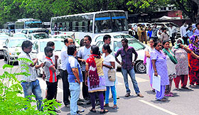 Family members of Dimple, who was murdered by her husband, block the Madhya Marg outside the GMSH-16 in Chandigarh on Saturday.